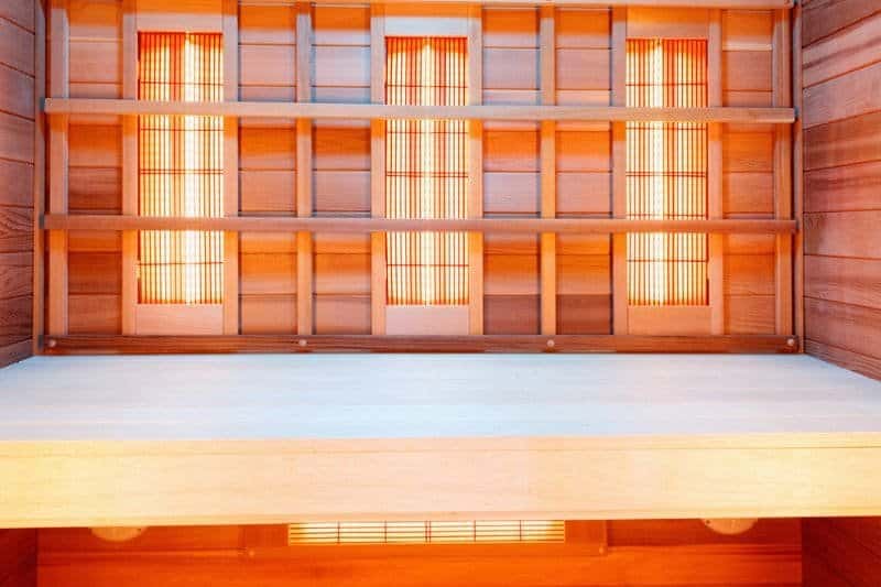 Sleek infrared sauna interior featuring an elegant wooden grid design, combining style with wellness.