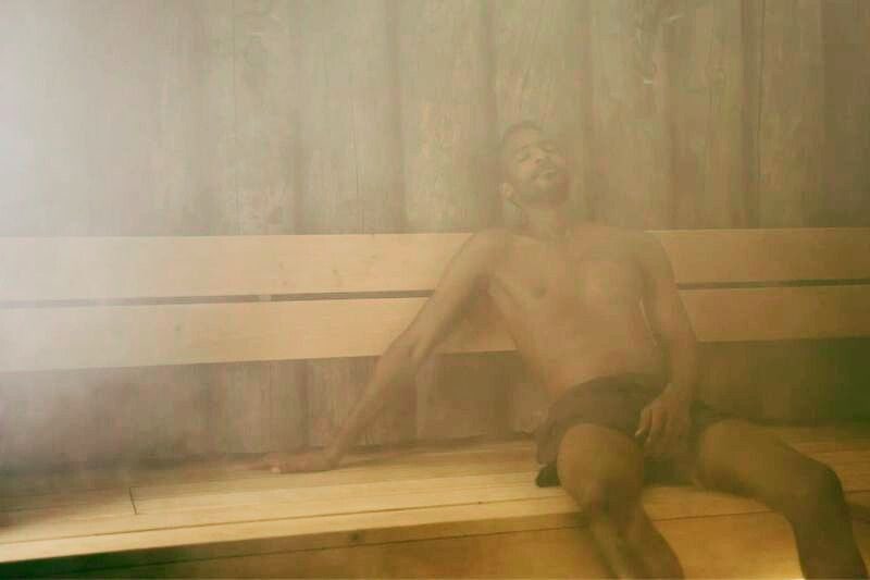 Man enjoying the benefits of a steam sauna session
