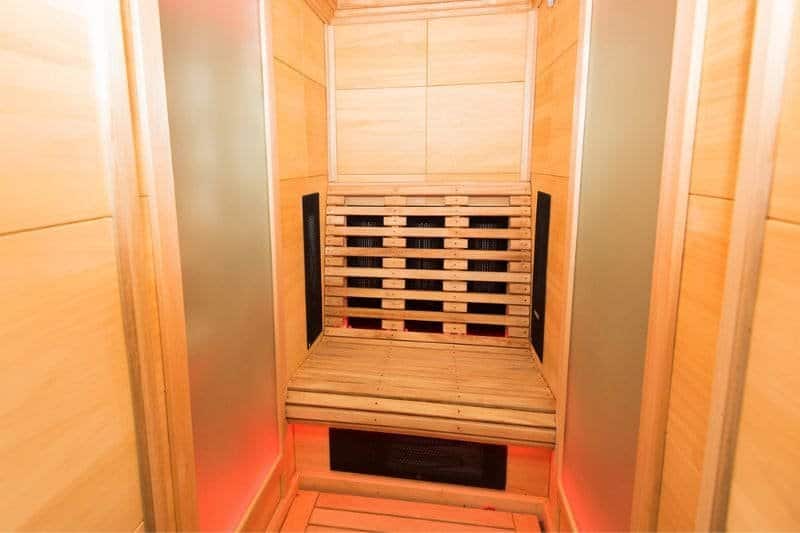Modern infrared sauna equipped with red light therapy panels, offering a contemporary and therapeutic sauna experience.