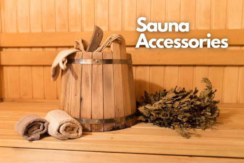Traditional sauna setup with wooden bucket, ladle, and towels, complemented by aromatic sauna whisk.