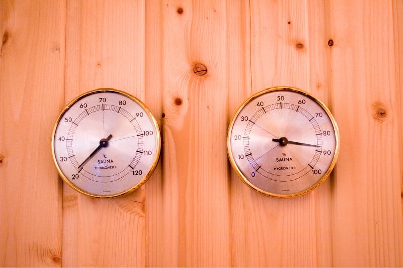 Dual display sauna thermometers featuring temperature and humidity gauges, perfect for maintaining optimal sauna conditions.