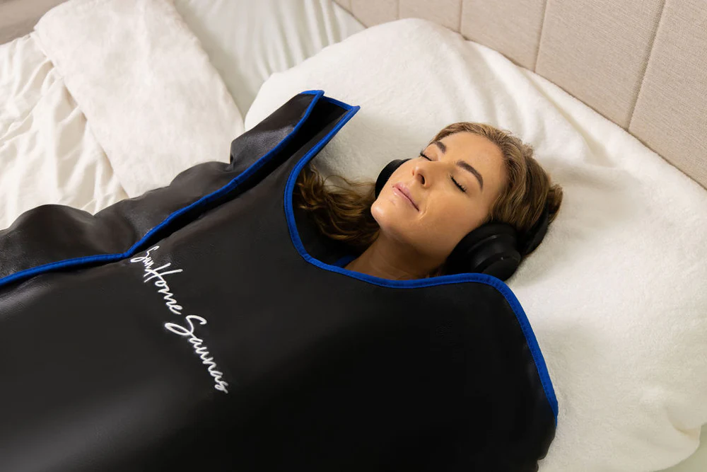 Woman relaxing in Sun Home Saunas sauna blanket, one of the best infrared sauna blankets in current times