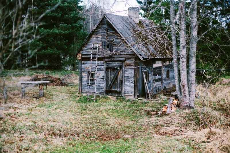 Dilapidated Sauna Structure Nestled in the Latvian Countryside, Exemplifying the Persistent Presence of Historical Sauna Traditions in Remote Rural Landscapes.