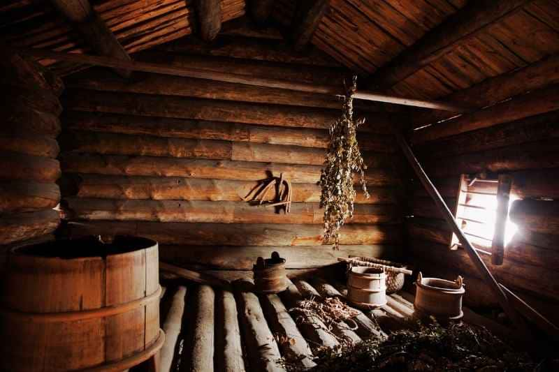 Rustic Wooden Interior of a Traditional Sauna in an Old Finnish House, Highlighting the Authentic Materials and Craftsmanship Integral to Historical Sauna Design.