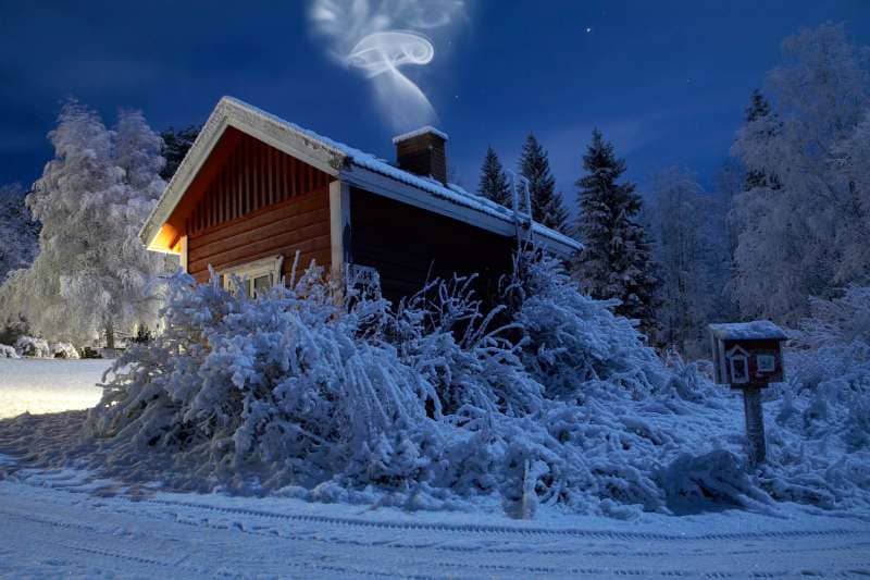 Outdoor Home Sauna in a snowy winter night scene, with warm light emanating from inside and smoke rising from the chimney.