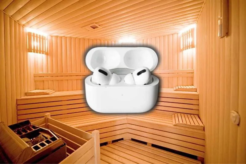 Interior of a wooden sauna with AirPods case superimposed, illustrating the question: Can you wear AirPods in the sauna?