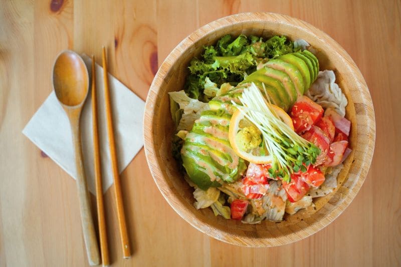 Nutritious dinner salad with avocado and vegetables