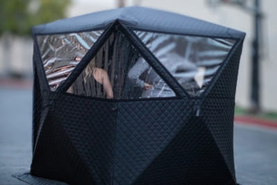  Illuminated portable sweat tent at night with transparent panels