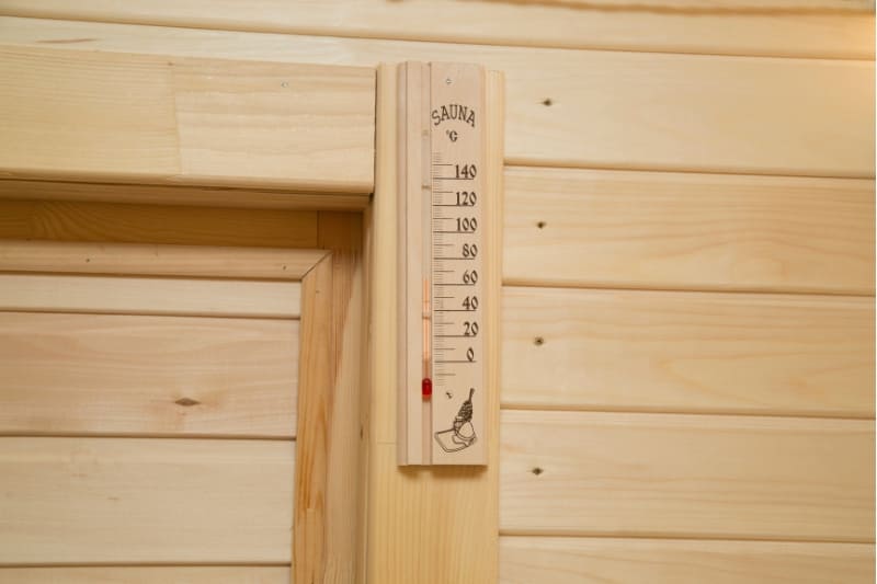 Wooden thermometer mounted in sauna, measuring temperature up to 140 degrees Celsius