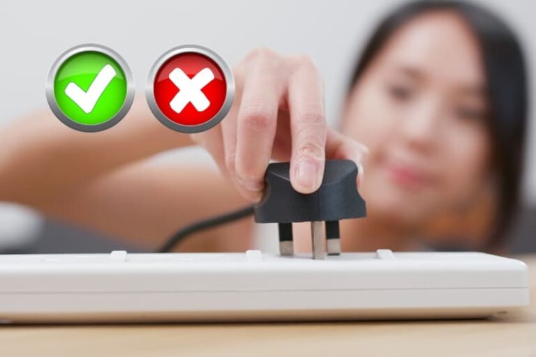 Close-up of a woman's hand plugging a sauna into a power strip with decision symbols overhead, illustrating can you plug a sauna into a regular outlet?