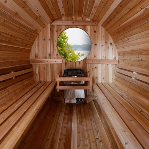 Interior view of the Almost Heaven Charleston 4-Person Canopy Barrel Sauna with the Port Window option