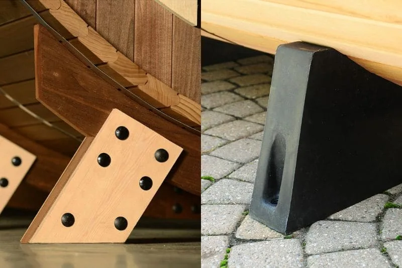 Barrel sauna foundation components showing wooden support bracket with mounting holes and heavy-duty rubber wedge for base stabilization