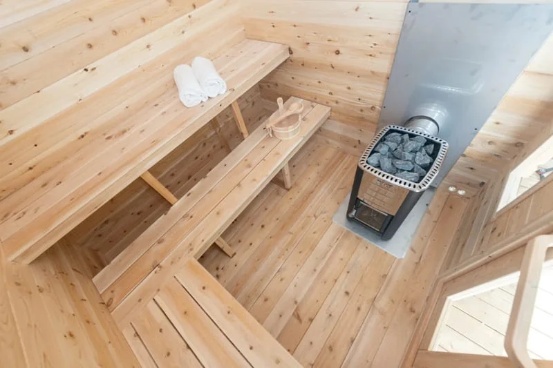 Overhead view of Dundalk CT Georgian sauna interior showing bench layout and heater placement