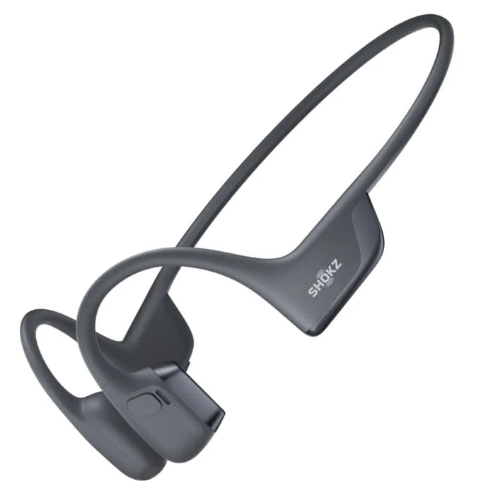 Black SHOKZ OpenRun Pro 2 headphones branded "SHOKZ" that sit in front of the ears.