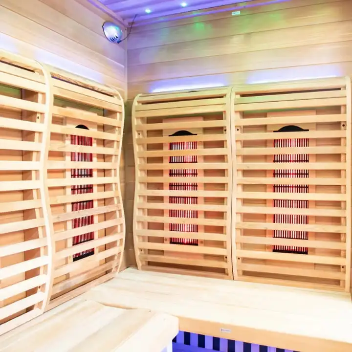 Sun Home Luminar infrared sauna featuring full-spectrum carbon heating panels with red infrared therapy and multicolor chromotherapy lighting system.