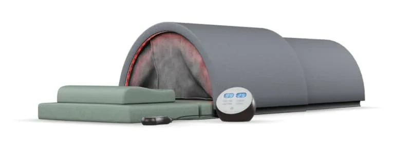 Sunlighten Solo infrared sauna showing the dome with red chromotherapy lighting, mint green pad, and the circular control panel for easy temperature adjustment.