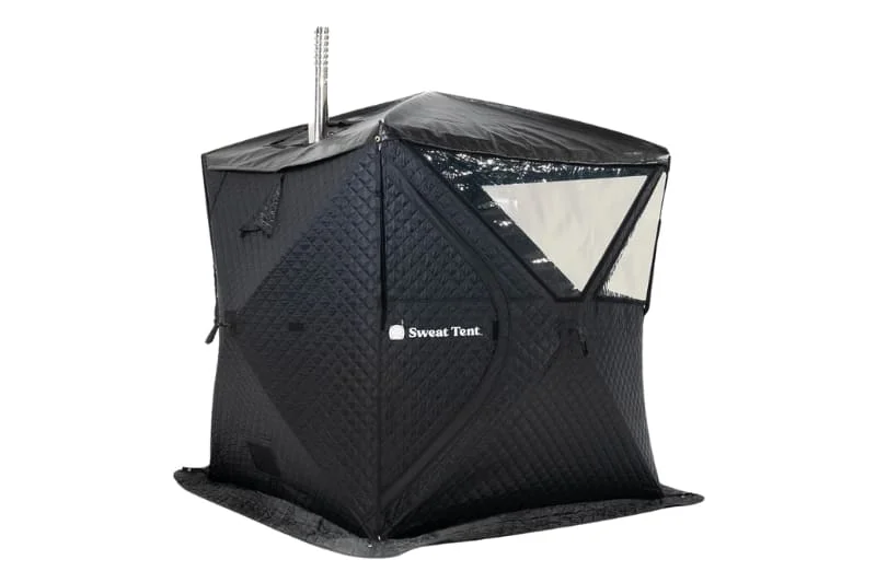 The Sweat Tent portable outdoor sauna against a white background. The sauna is made up up of black fabric with windows and a silver color metal chimney emerging from inside