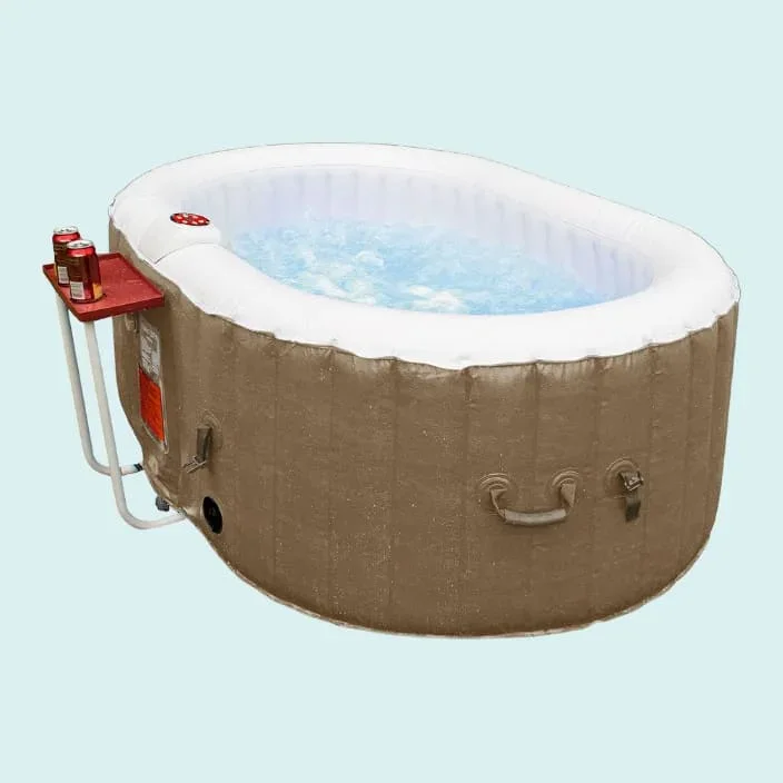 Oval-shaped ALEKO inflatable hot tub in brown tan color with white rim and external heating system, portable spa with bubble jets and external pump unit for backyard relaxation