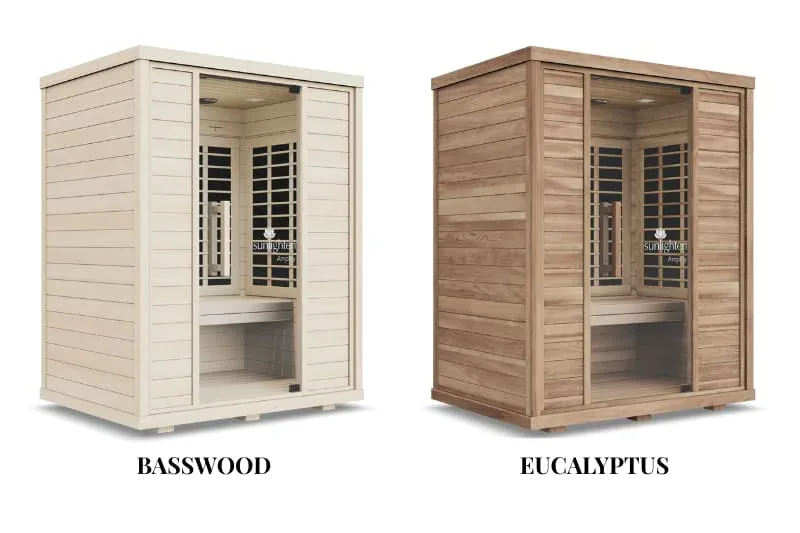 Side-by-side comparison of Sunlighten Amplify infrared sauna in basswood and eucalyptus wood finishes showing different grain patterns