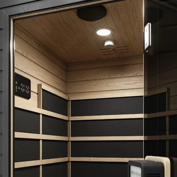 Inside view of SaunaBox Solara infrared sauna with wood paneling, LED lighting, and digital control panel